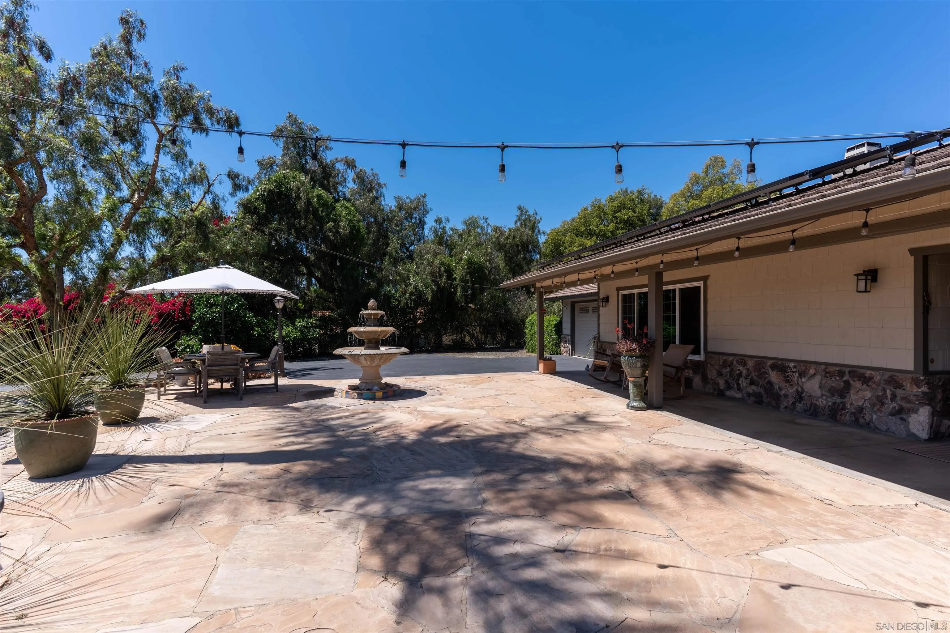 1045 Capra Way Fallbrook, CA 92028 - Photo 35 of 44 a view of a chair and tables in the patio