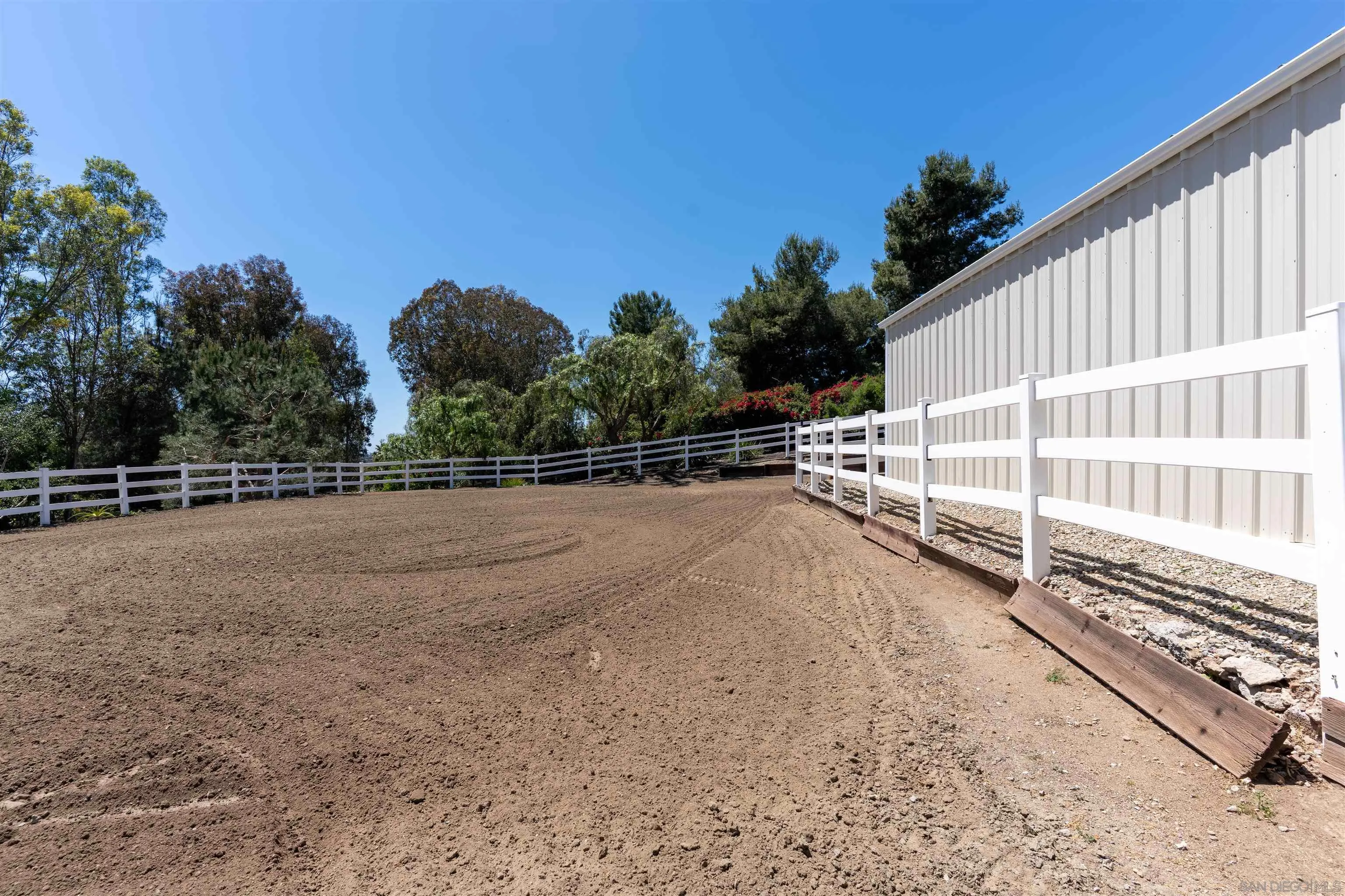 1045 Capra Way Fallbrook, CA 92028 - Photo 38 of 44 a view of a backyard with a fence