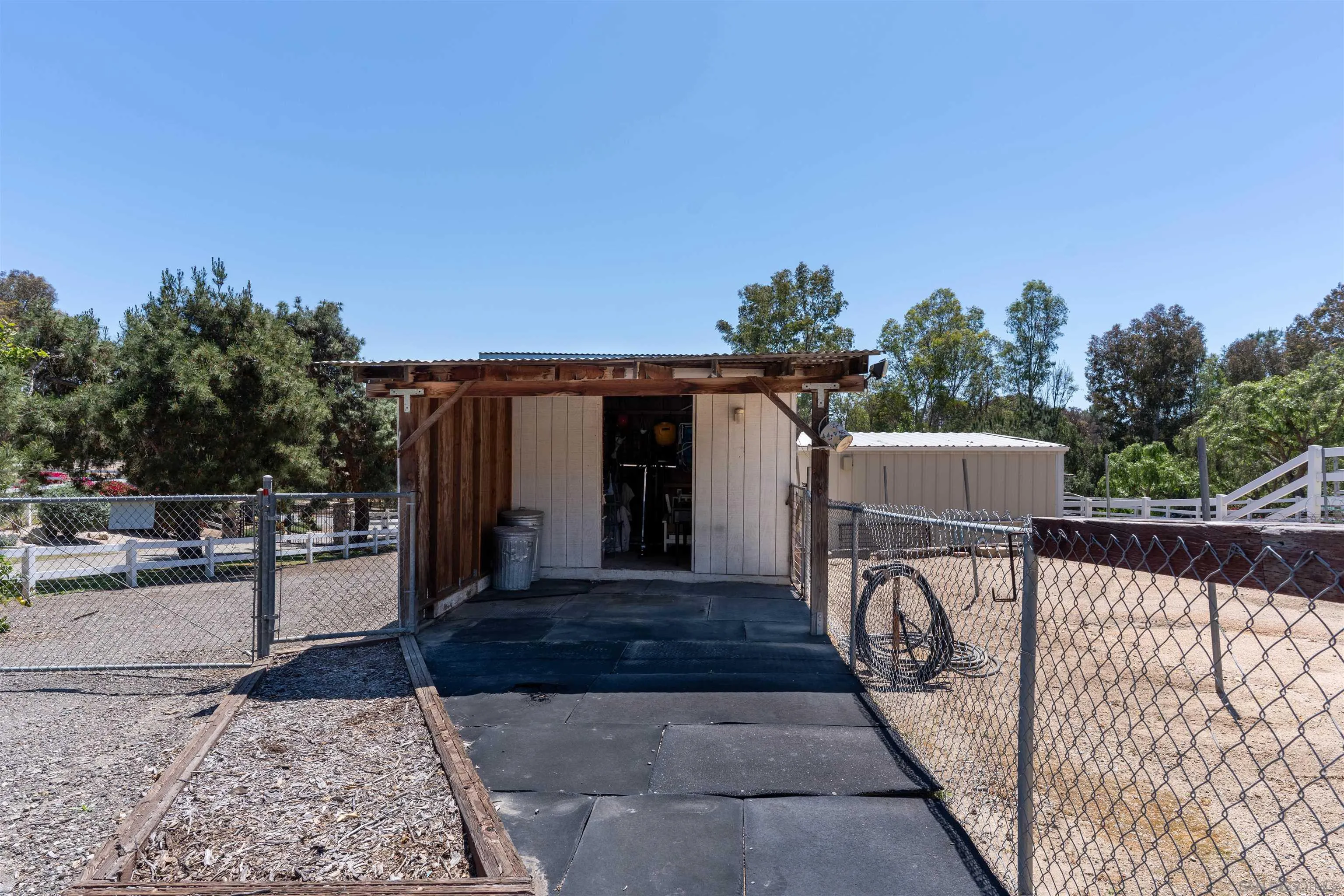 1045 Capra Way Fallbrook, CA 92028 - Photo 39 of 44 a view of a patio with a table and chairs