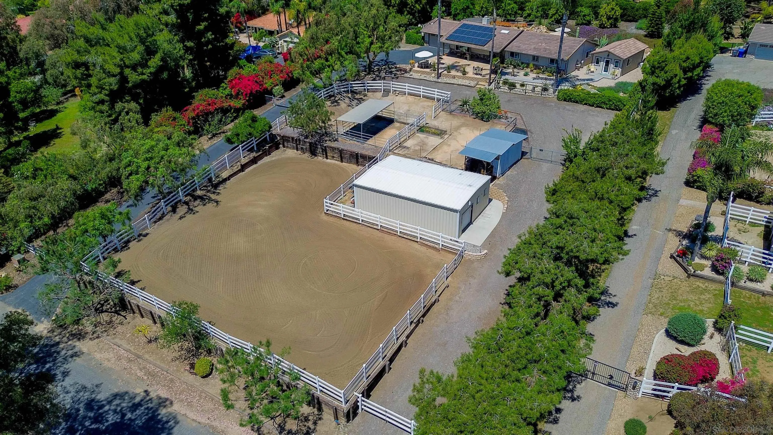 1045 Capra Way Fallbrook, CA 92028 - Photo 43 of 44 an aerial view of a house with a yard and garden