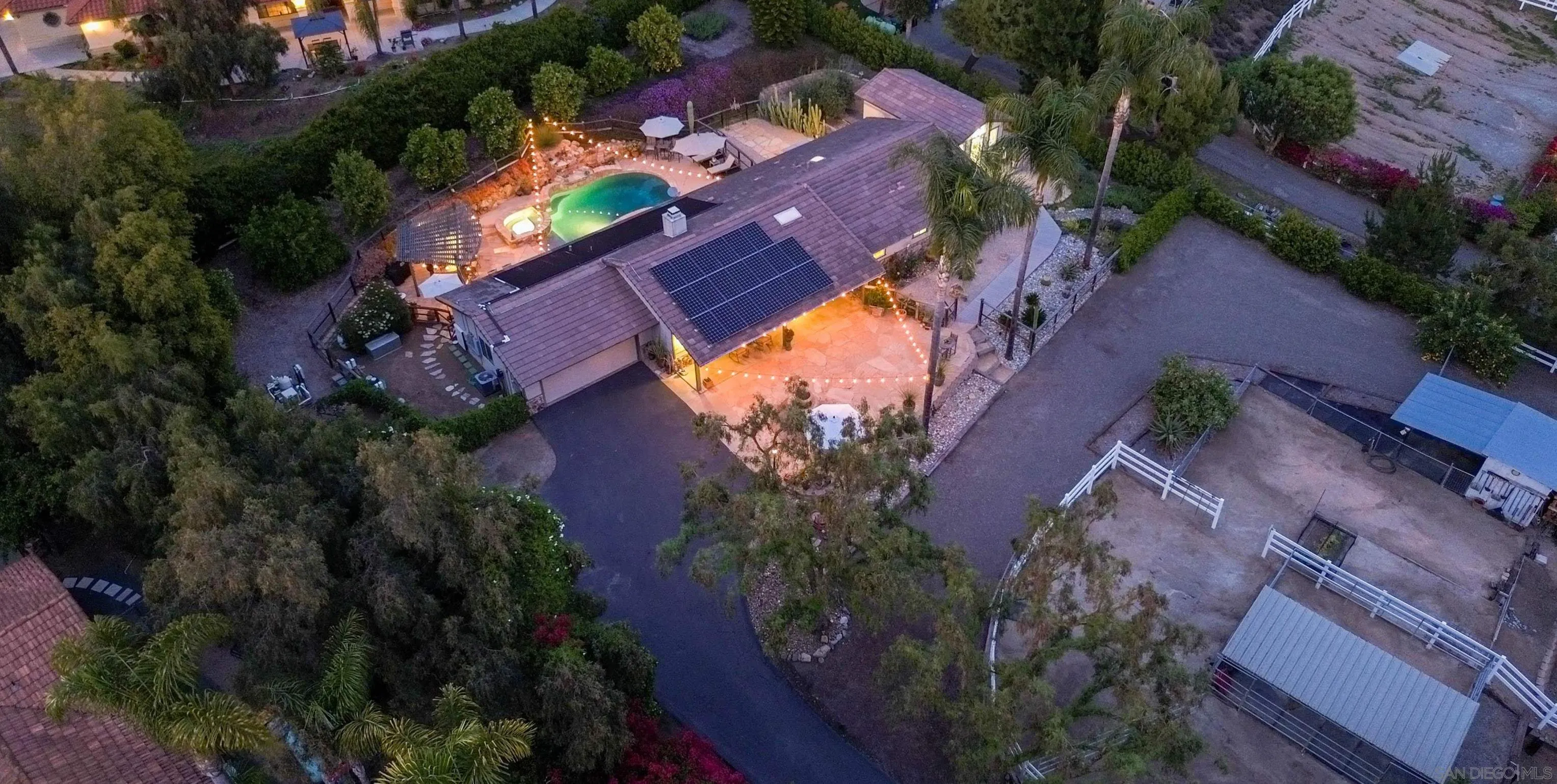 1045 Capra Way Fallbrook, CA 92028 - Photo 8 of 44 an aerial view of a house with a yard and swimming pool