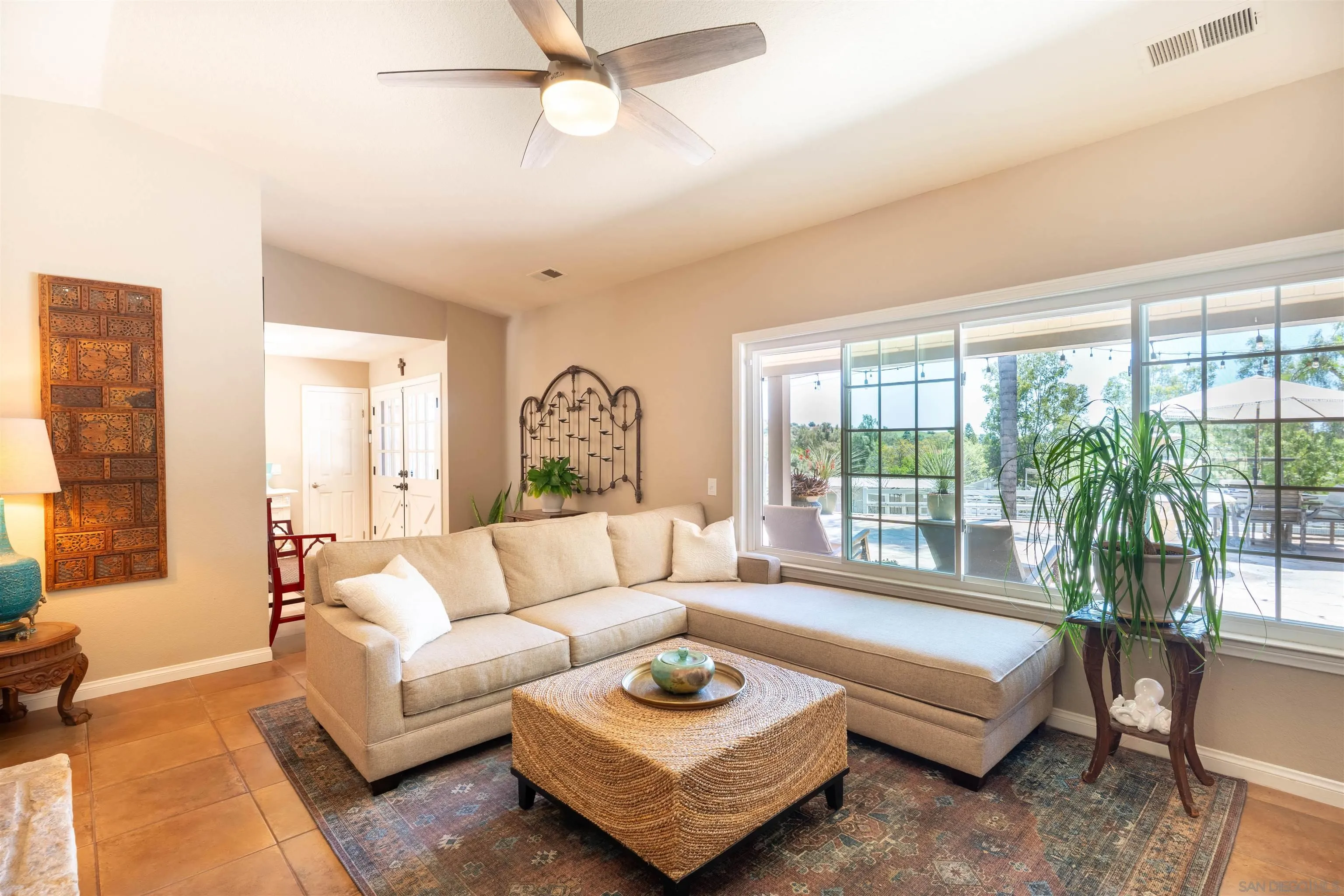 1045 Capra Way Fallbrook, CA 92028 - Photo 10 of 44 a living room with furniture and a large window