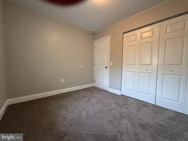 a view of an empty room and entryway