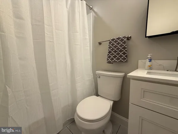 a bathroom with a toilet and a sink