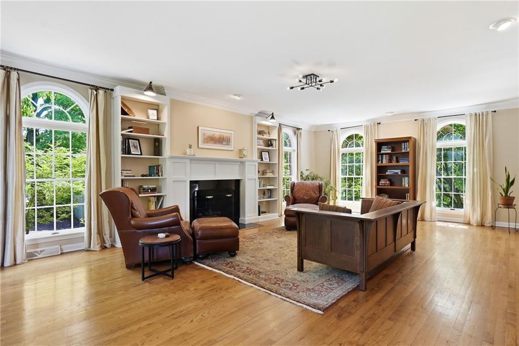 900 Settlers Ridge Road Pittsburgh, PA 15238 - Photo 6 of 50 Six dramatic floor-to-ceiling arched windows fill the spacious living room with natural light and beautiful views.