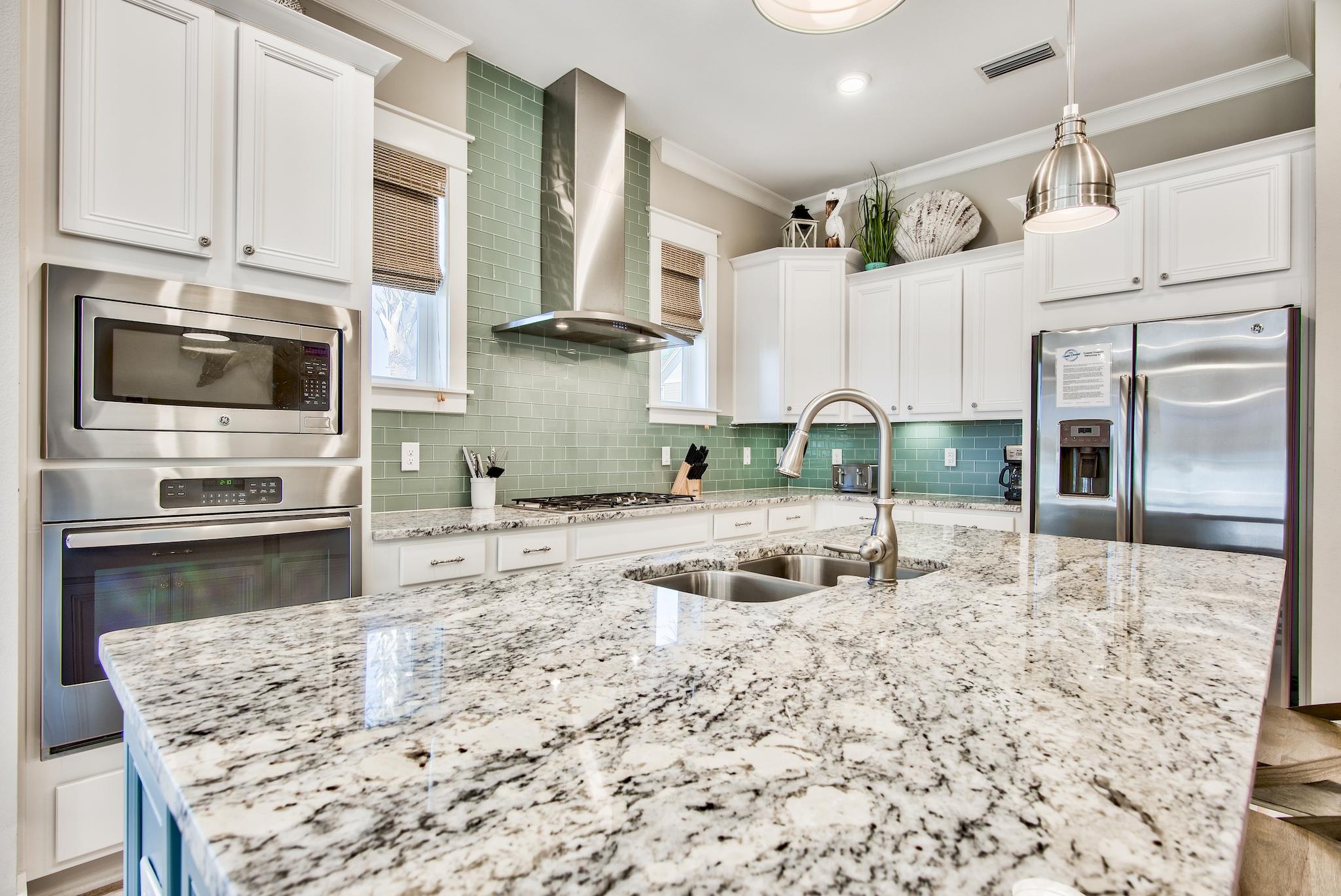 12 York Lane, Unit B Inlet Beach, FL 32461 - Photo 8 of 45 a kitchen with stainless steel appliances granite countertop a sink a stove and cabinets
