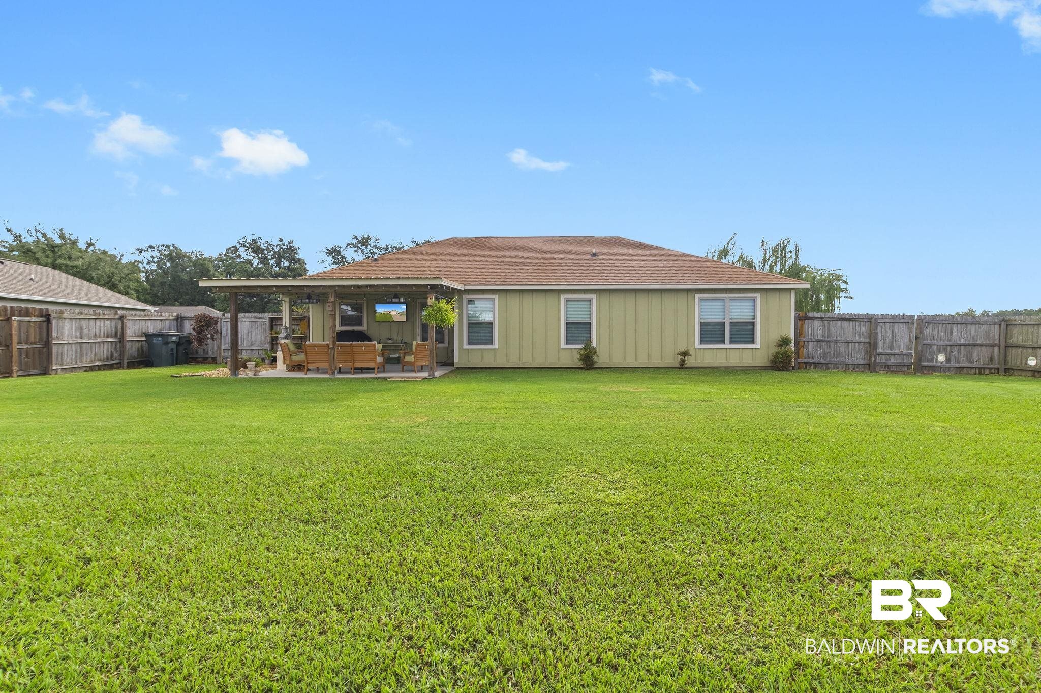 203 Lakefront Circle Summerdale, AL 36580 - Photo 58 of 69 Back of house with a lawn and a patio area