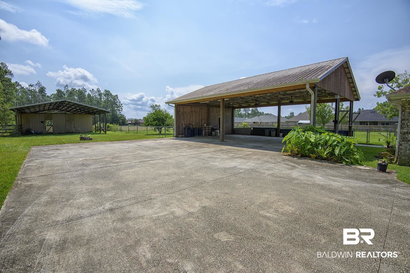 9686 County Road 65 Foley, AL 36535 - Photo 13 of 47 Carport has an extra storage area with window unit