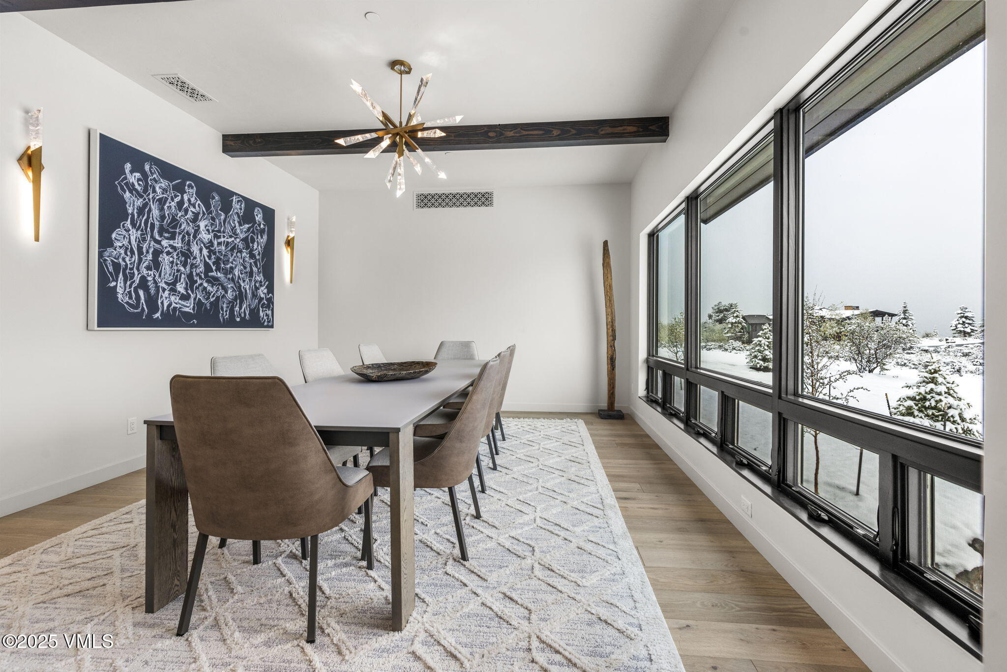 966 Webb Peak Edwards, CO 81632 - Photo 21 of 70 a view of a dining room with furniture window and wooden floor