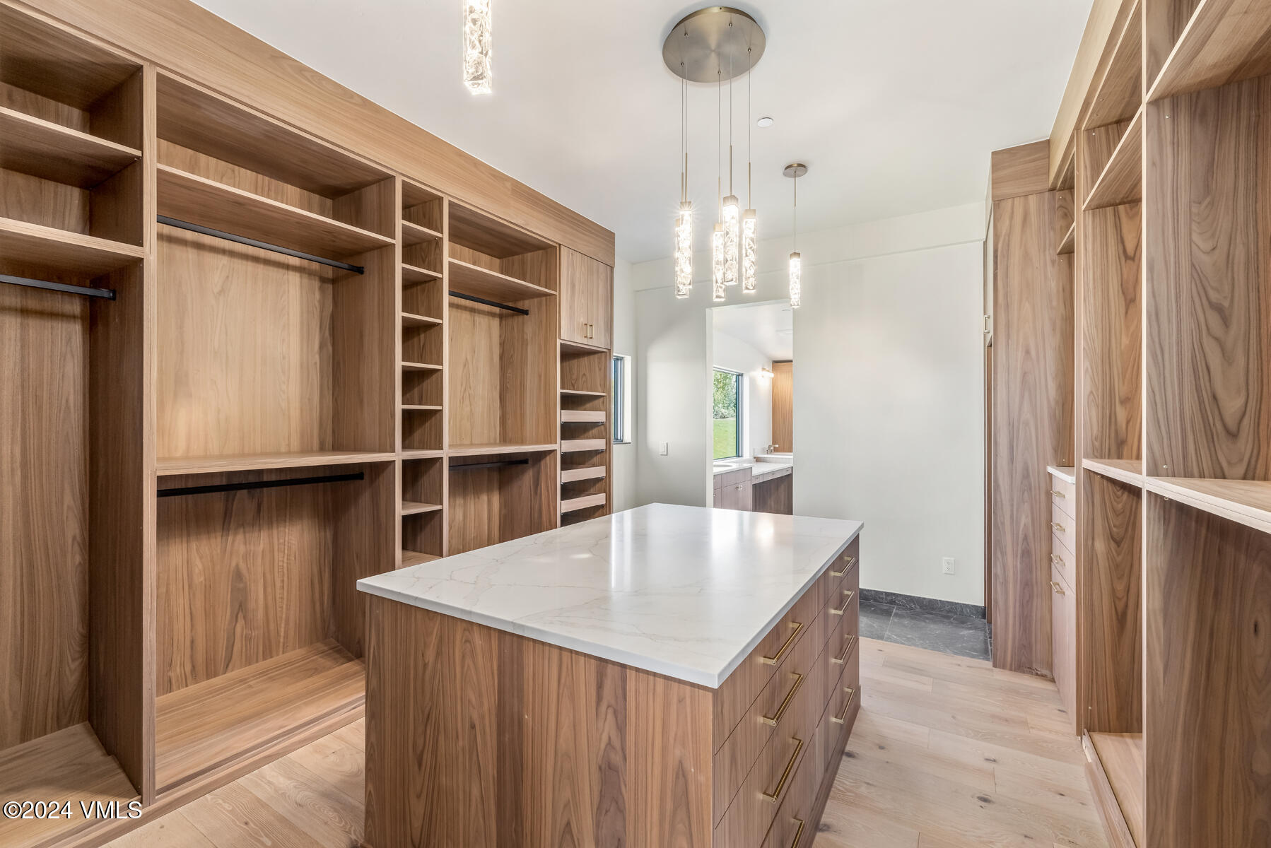966 Webb Peak Edwards, CO 81632 - Photo 32 of 70 a kitchen with kitchen island a refrigerator and wooden floor
