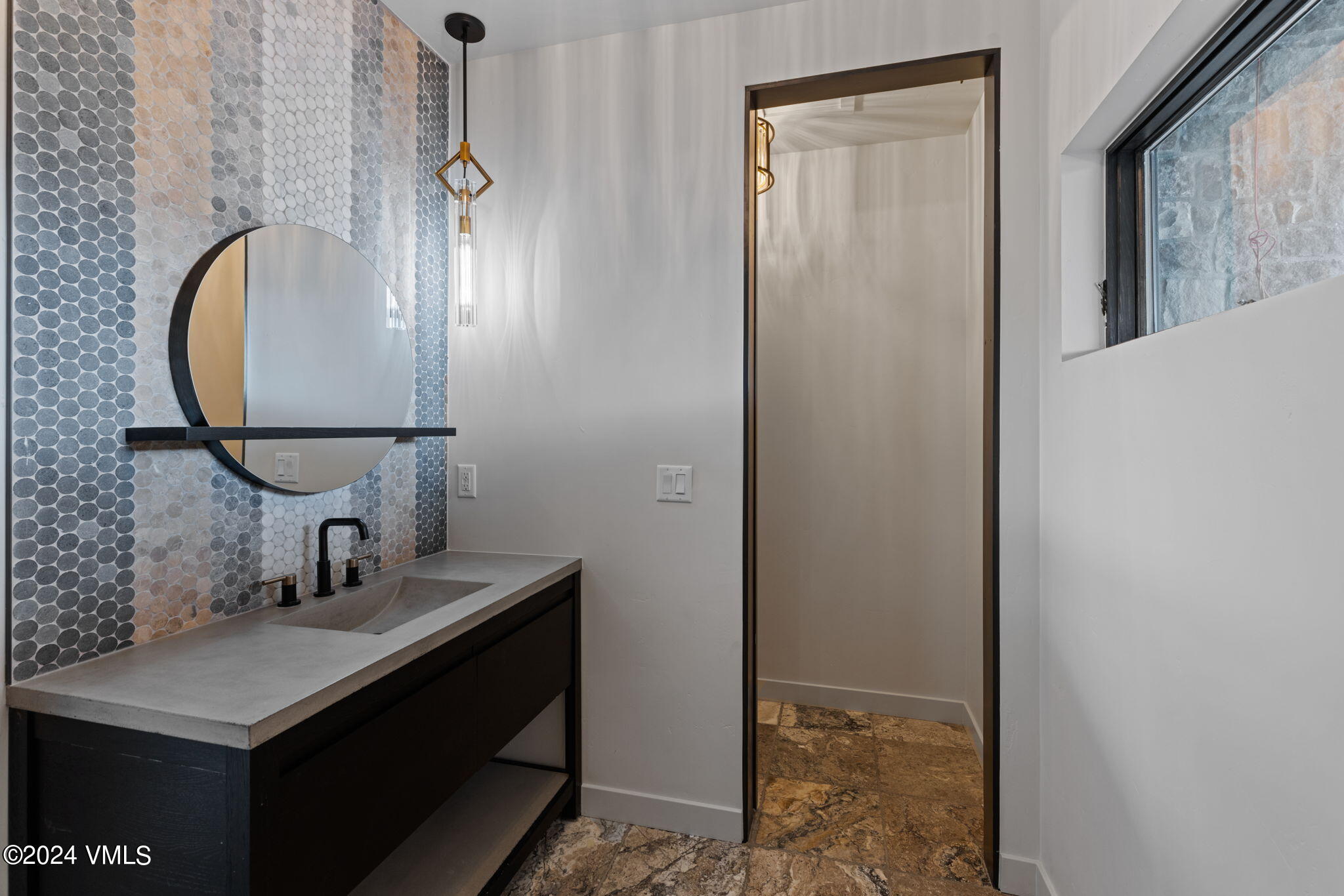 966 Webb Peak Edwards, CO 81632 - Photo 34 of 70 a bathroom with a sink vanity and a mirror