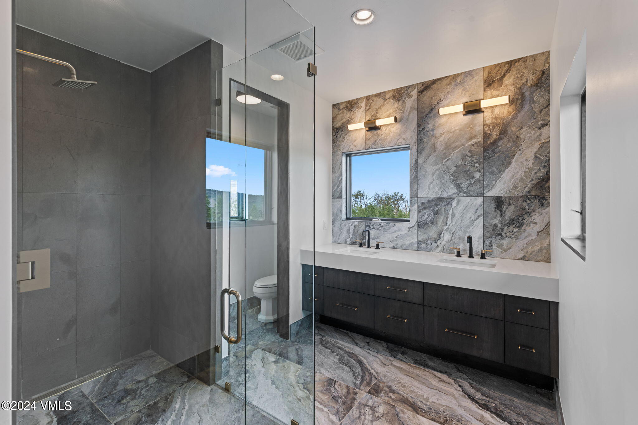966 Webb Peak Edwards, CO 81632 - Photo 43 of 70 a bathroom with a double vanity sink and a mirror