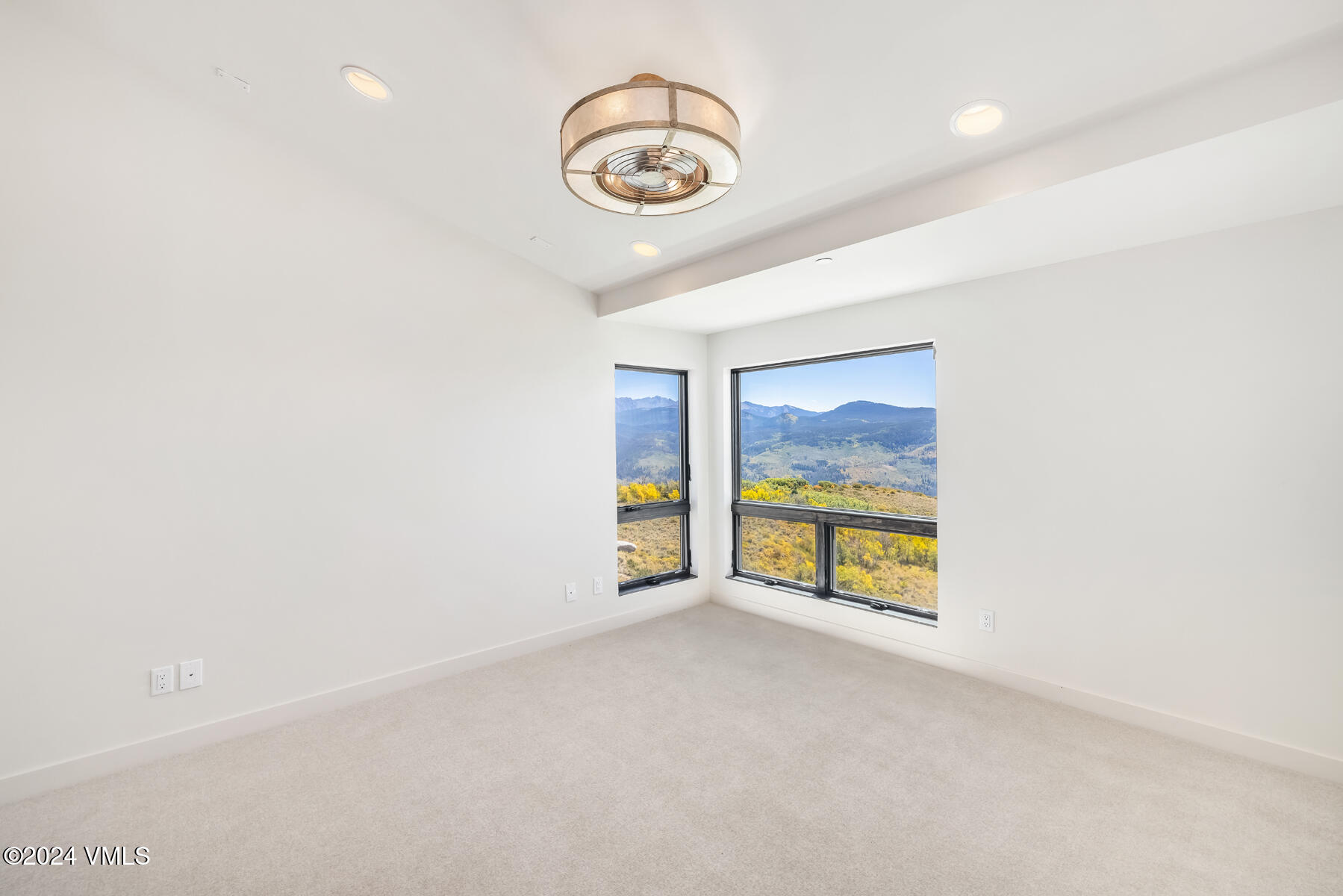 966 Webb Peak Edwards, CO 81632 - Photo 46 of 70 an empty room with projector and windows