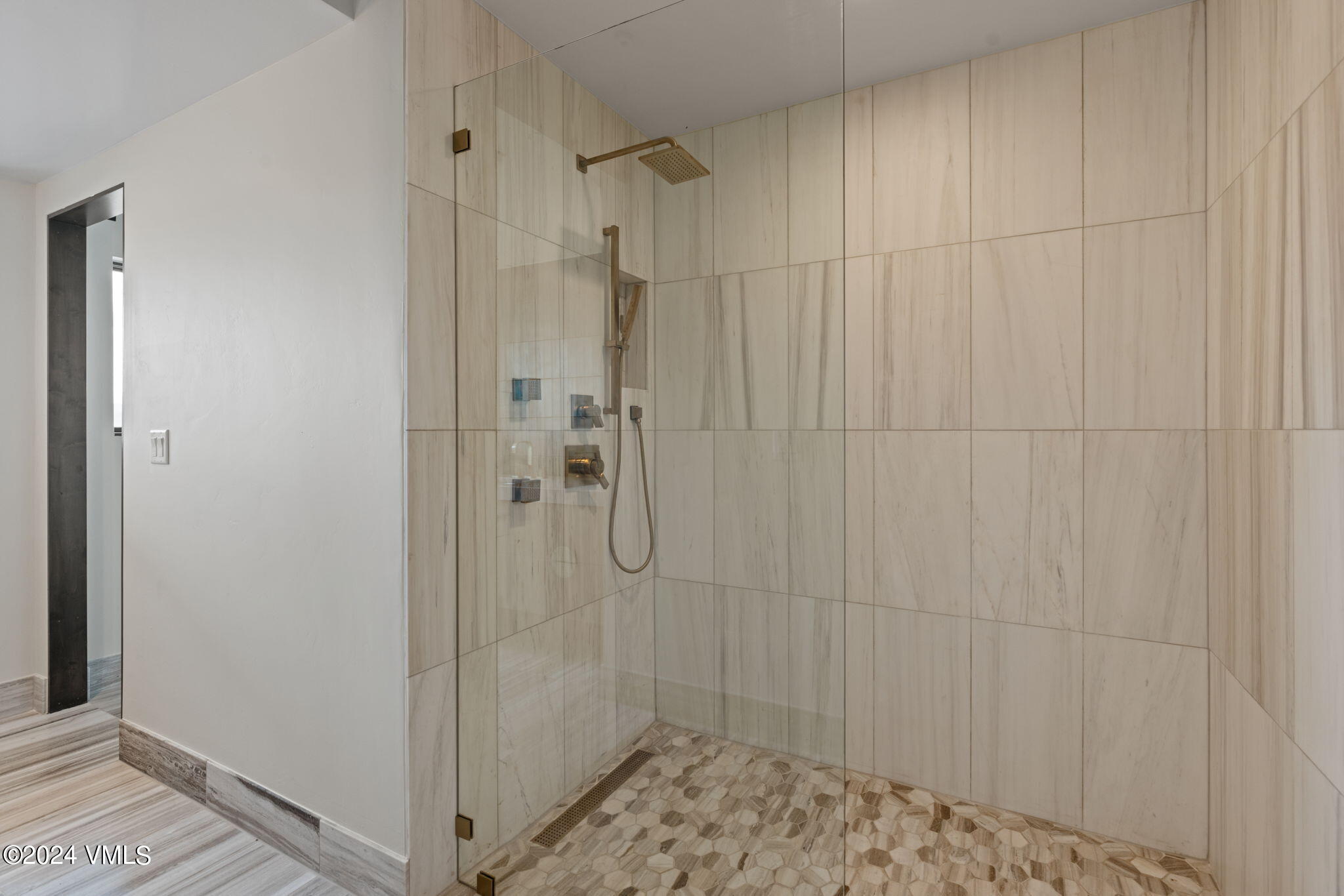 966 Webb Peak Edwards, CO 81632 - Photo 52 of 70 a bathroom with a glass shower door