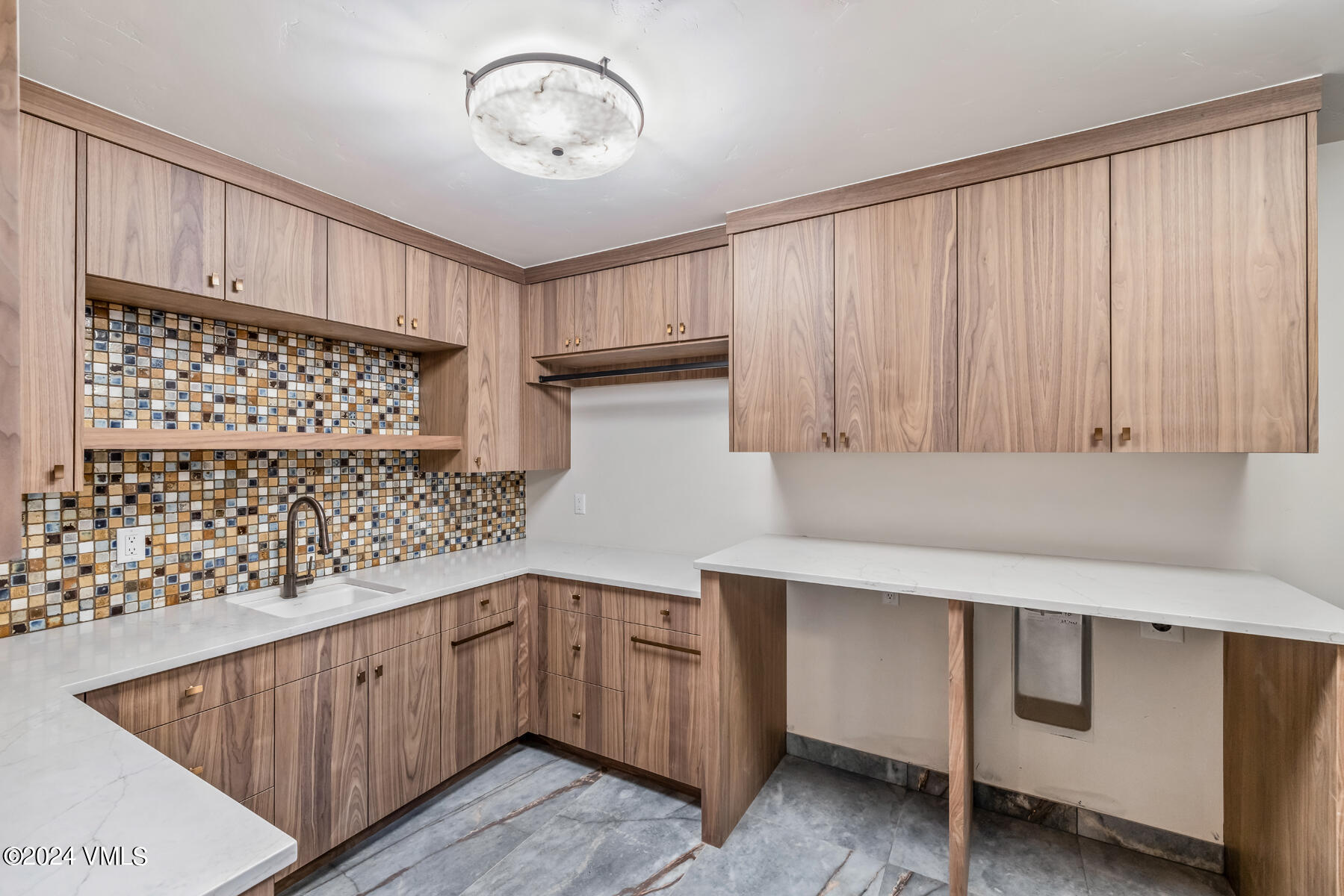 966 Webb Peak Edwards, CO 81632 - Photo 55 of 70 a kitchen with a cabinets and chandelier