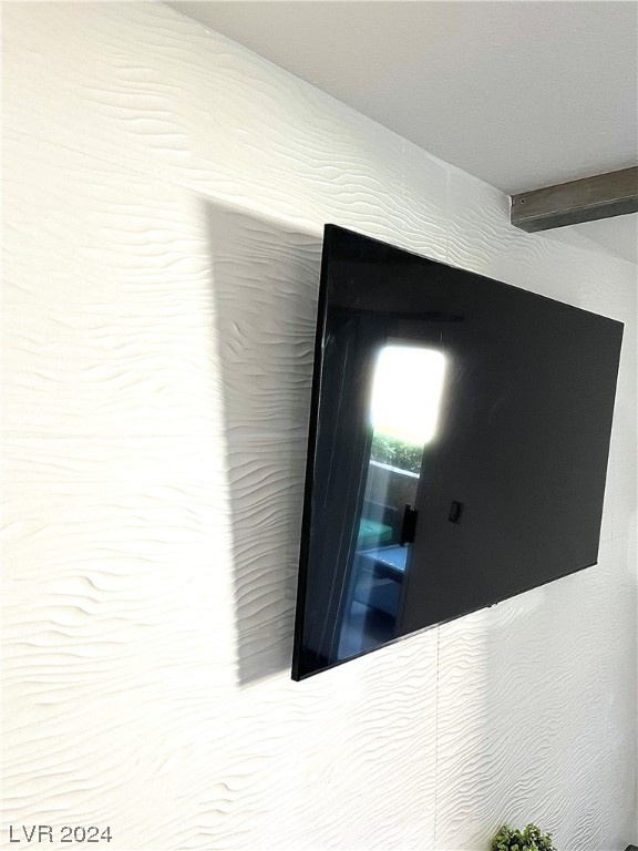 2300 East Silverado Ranch Boulevard, Unit 1011 Las Vegas, NV 89123 - Photo 4 of 27 Tiled accent wall