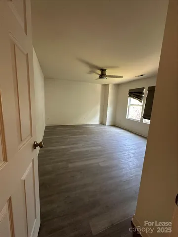 a view of a hallway with a window