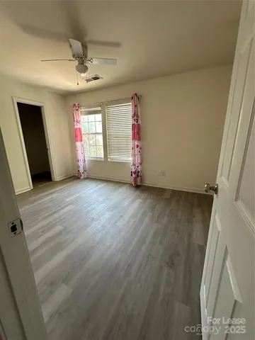 a bathroom with a toilet and a bathtub