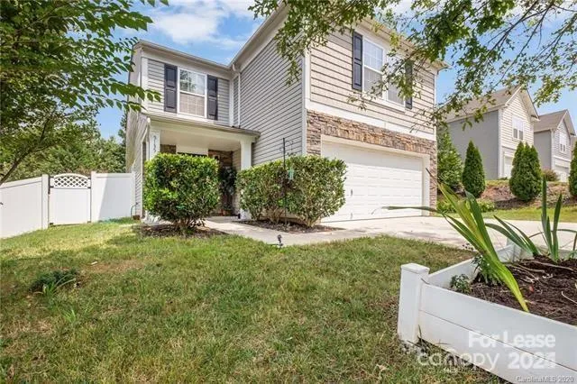 front view of a house with a yard