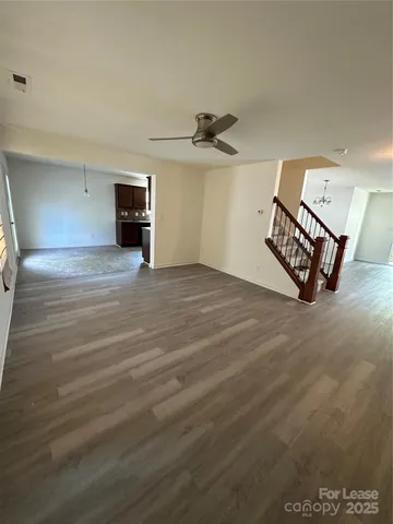 a kitchen with stainless steel appliances granite countertop sink stove top oven and cabinets