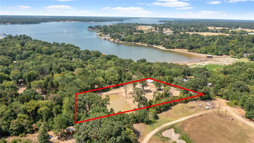7204 Lance Eustace, TX 75124 - Photo 3 of 25 Birds eye view of property with a water view and a forest view