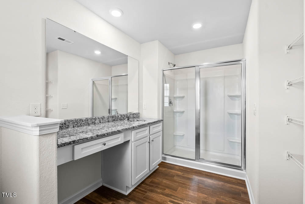 386 Crow Field Street Roxboro, NC 27574 - Photo 13 of 18 a bathroom with a granite countertop sink and a mirror