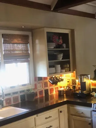 a kitchen with a sink and a window