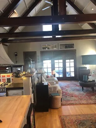 a living room with furniture a chandelier
