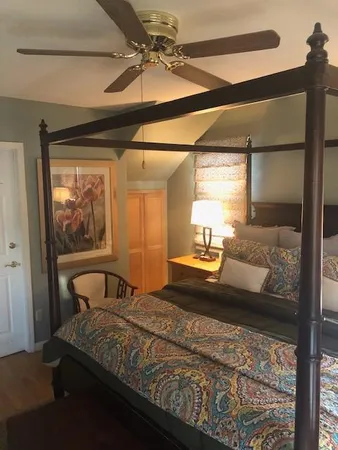 a bedroom with a bed and window