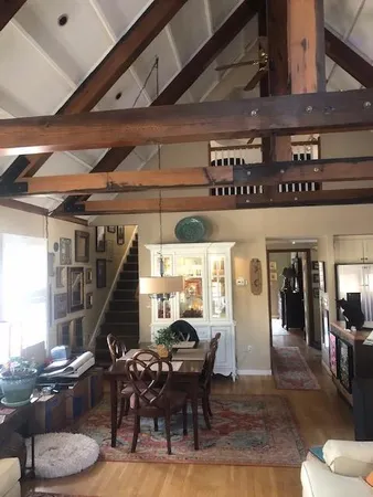 a dining room with furniture and chandelier