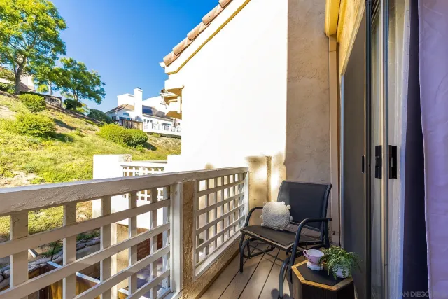 a view of balcony with furniture