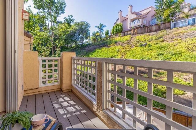 a view of a balcony with wooden floor