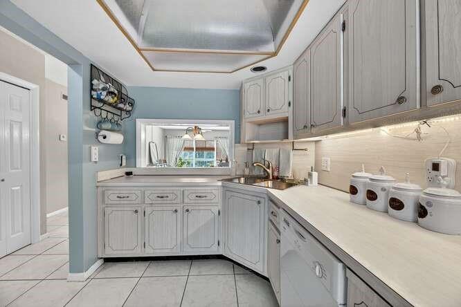 1200 Southwest 12th Court, Unit 203 Fort Lauderdale, FL 33315 - Photo 13 of 23 a kitchen with cabinets and appliances