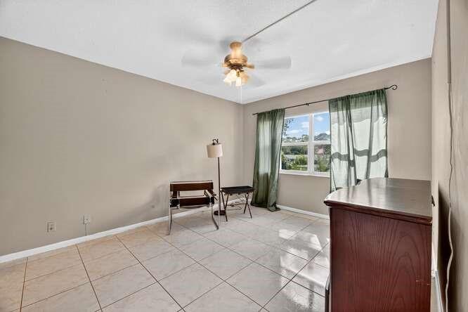 1200 Southwest 12th Court, Unit 203 Fort Lauderdale, FL 33315 - Photo 15 of 23 a living room with furniture and a window