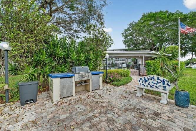 1200 Southwest 12th Court, Unit 203 Fort Lauderdale, FL 33315 - Photo 21 of 23 a view of a patio with chairs and plants