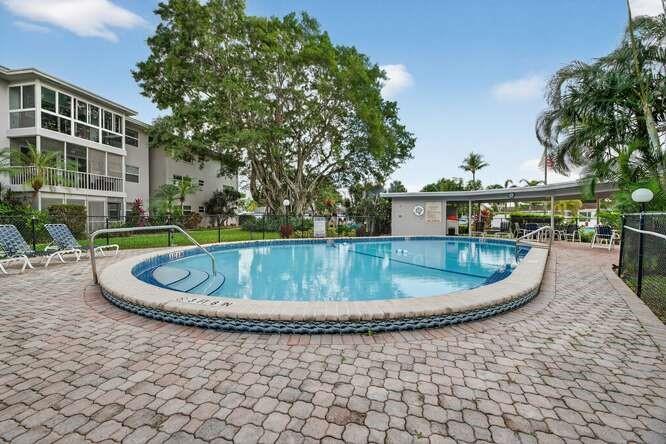 1200 Southwest 12th Court, Unit 203 Fort Lauderdale, FL 33315 - Photo 6 of 23 a view of a swimming pool with a patio