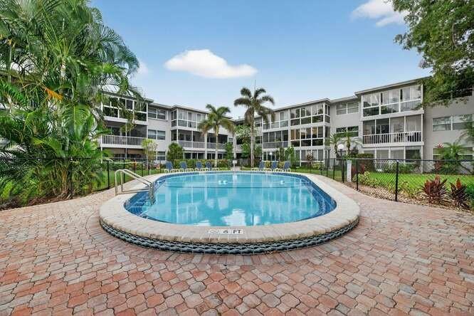 1200 Southwest 12th Court, Unit 203 Fort Lauderdale, FL 33315 - Photo 7 of 23 a view of outdoor space and swimming pool