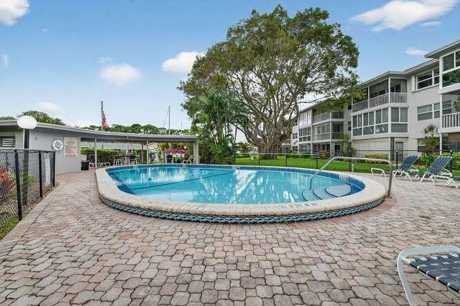 1200 Southwest 12th Court, Unit 203 Fort Lauderdale, FL 33315 - Photo 8 of 23 a view of a swimming pool with a patio
