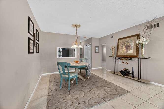 1200 Southwest 12th Court, Unit 203 Fort Lauderdale, FL 33315 - Photo 10 of 23 a dining room with furniture and a window
