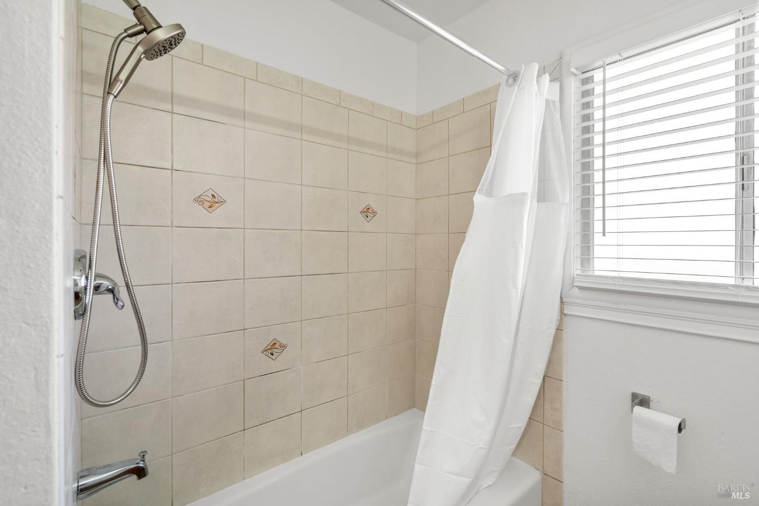 458 Spring Street Richmond, CA 94804 - Photo 14 of 26 a bathroom with a shower