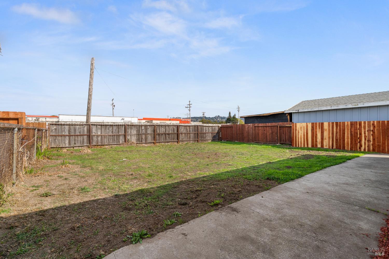 458 Spring Street Richmond, CA 94804 - Photo 23 of 26 a view of a swimming pool with a yard