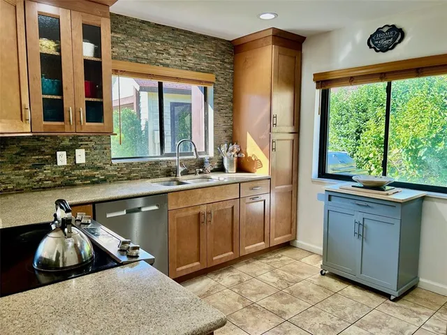 a kitchen with a sink and a window