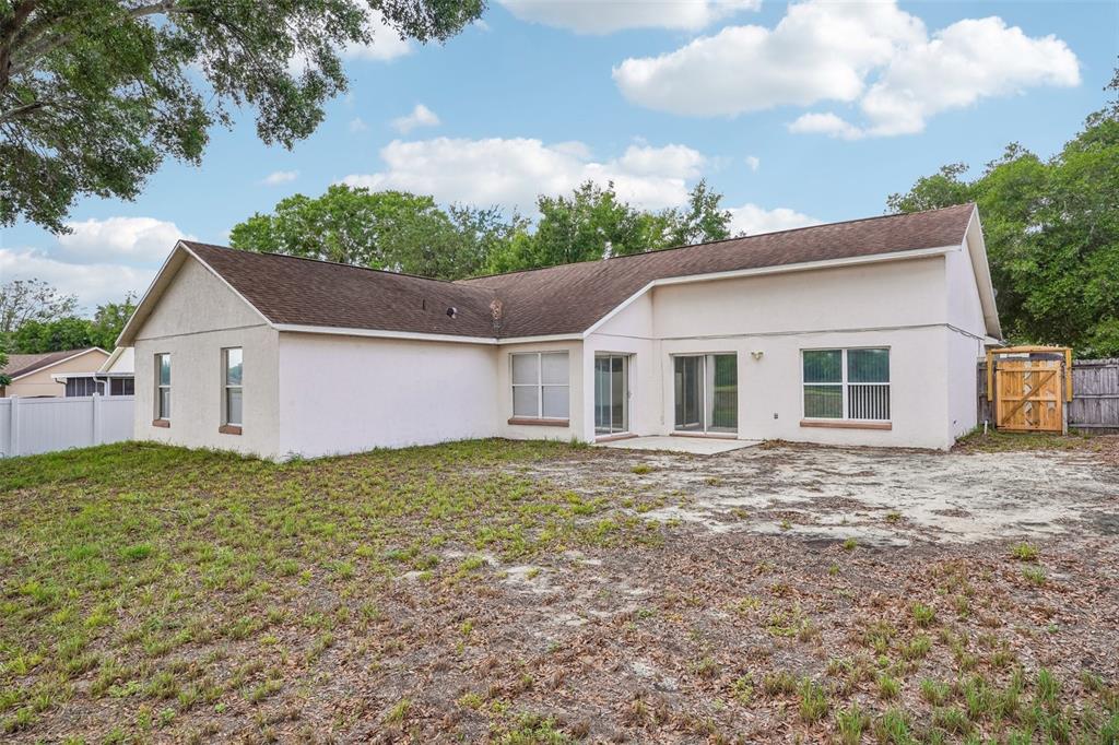 2596 Alclobe Circle Ocoee, FL 34761 - Photo 55 of 70 a front view of a house with garden