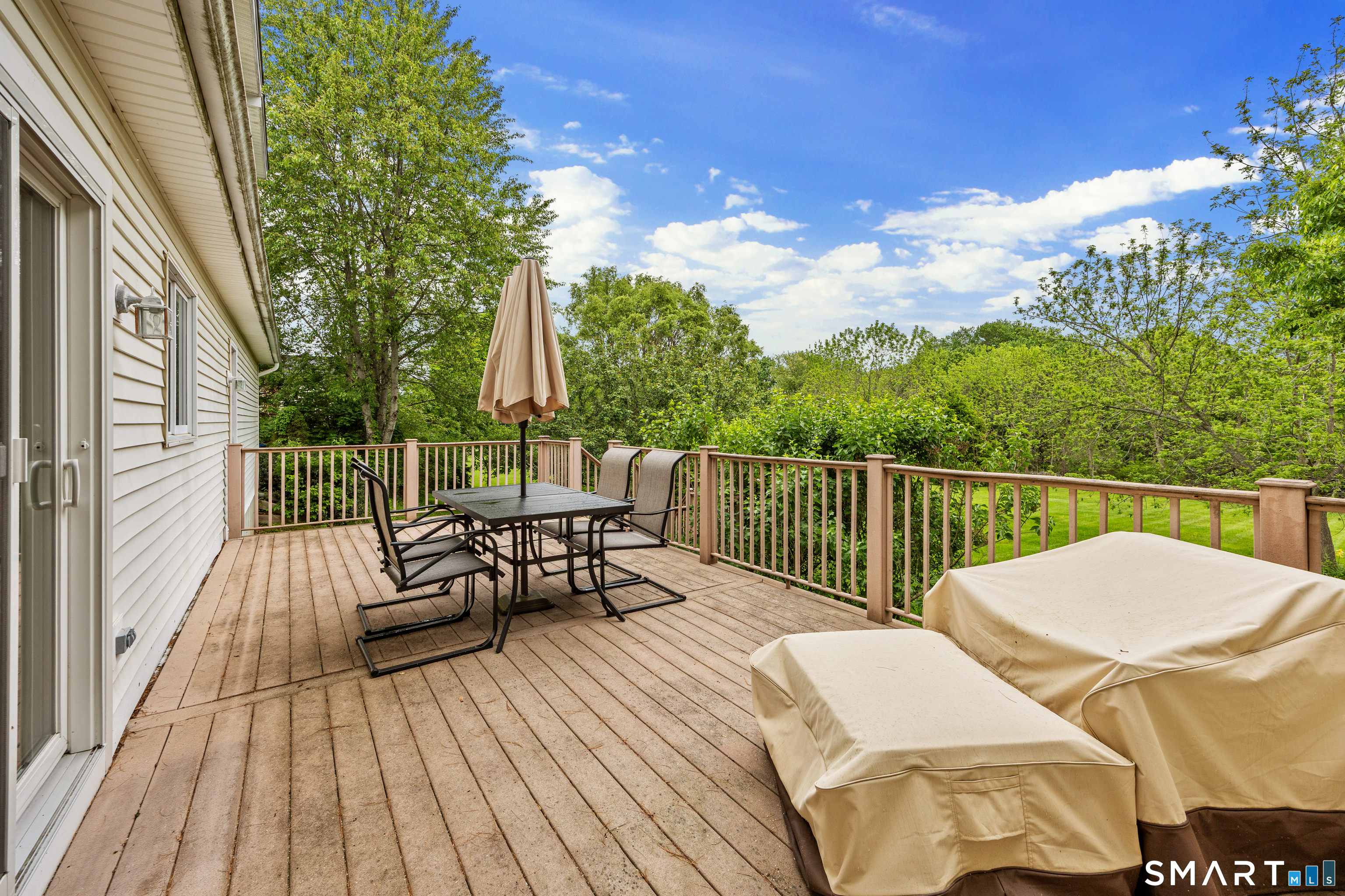 694 Millbrook Road Middletown, CT 06457 - Photo 30 of 34 a view of balcony with wooden floor and outdoor seating