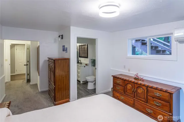 a living room with a dining table and chairs
