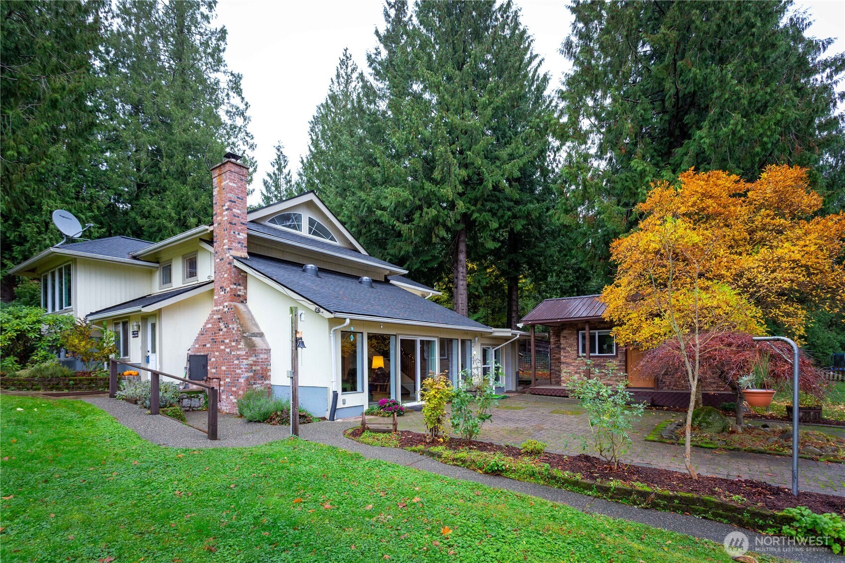 5363 Reese Hill Road Sumas, WA 98295 - Photo 2 of 40 a front view of house with a garden and patio