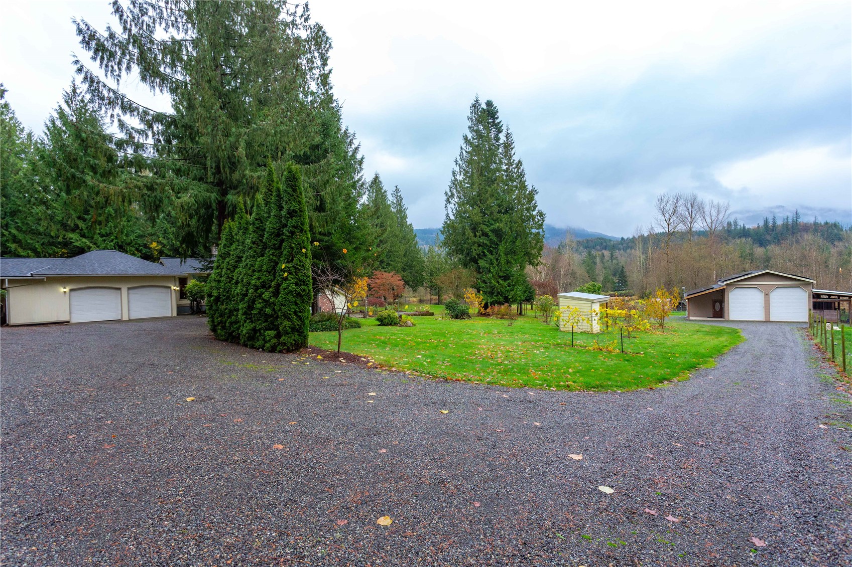 5363 Reese Hill Road Sumas, WA 98295 - Photo 30 of 40 a view of a house with a yard and large trees