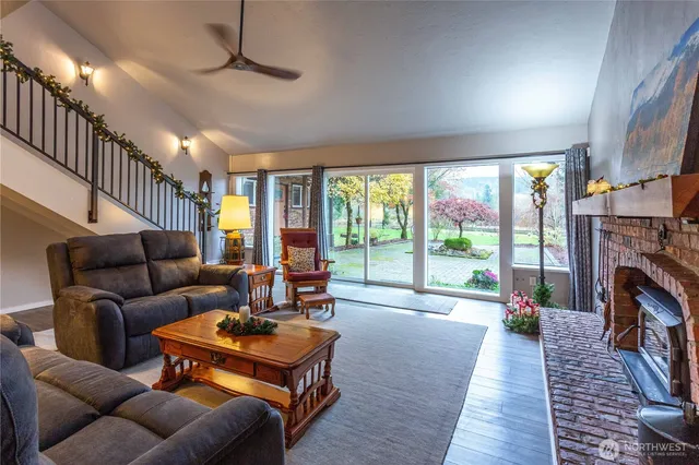 a bed sitting in a spacious bedroom next to a window