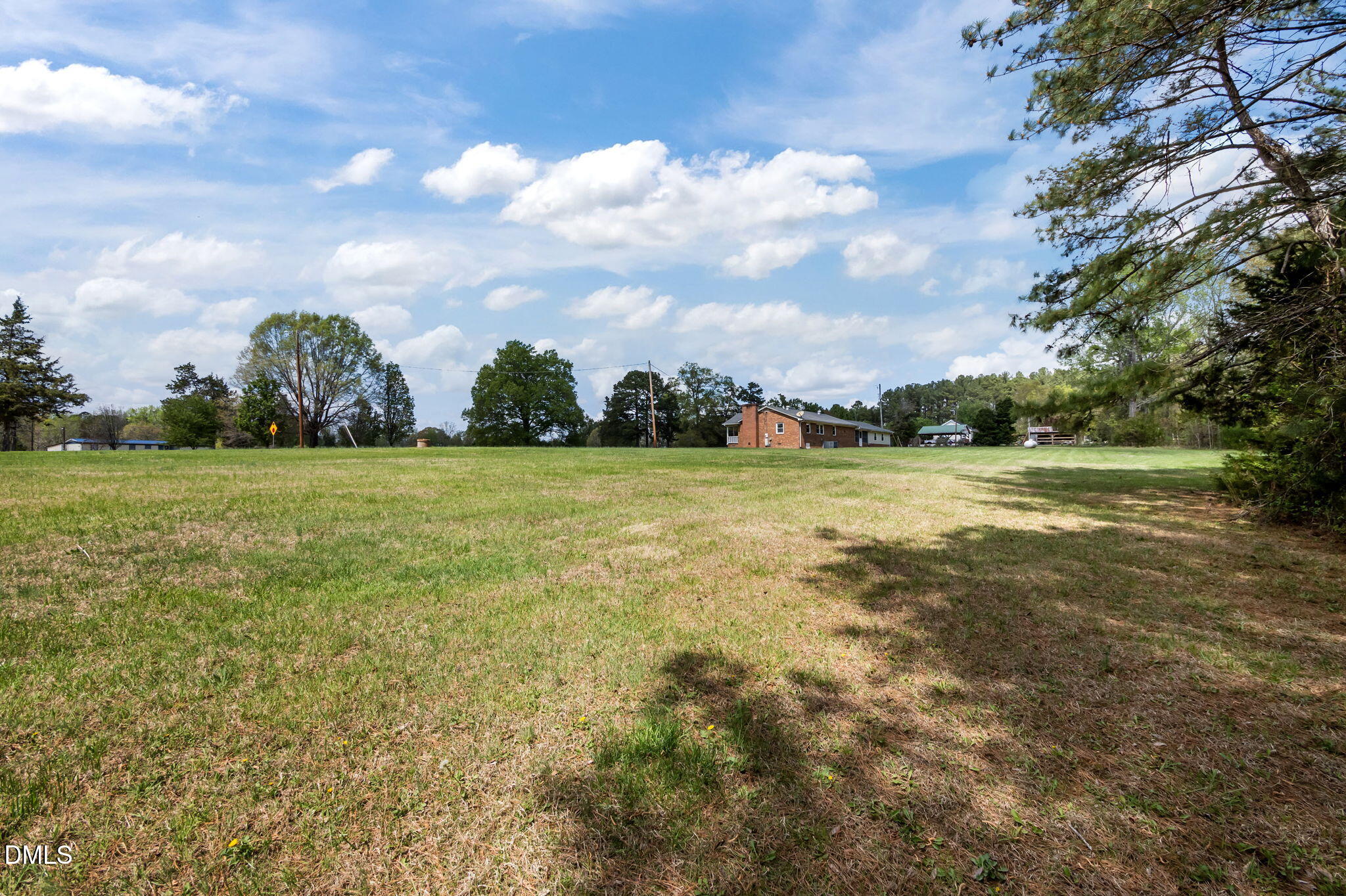 95 Harold Gill Road Roxboro, NC 27574 - Photo 45 of 53 a view of a green field with wooden fence