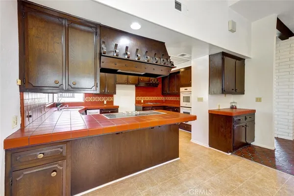 a bathroom with a granite countertop sink mirror and shower